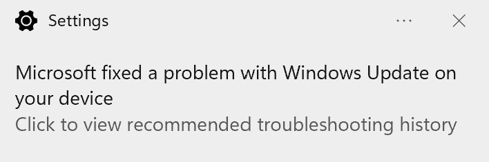 Snímek obrazovky se zprávou o uživatelském rozhraní : Microsoft opravili problém s Windows na vašem zařízení. Kliknutím zobrazíte doporučenou historii řešení potíží."