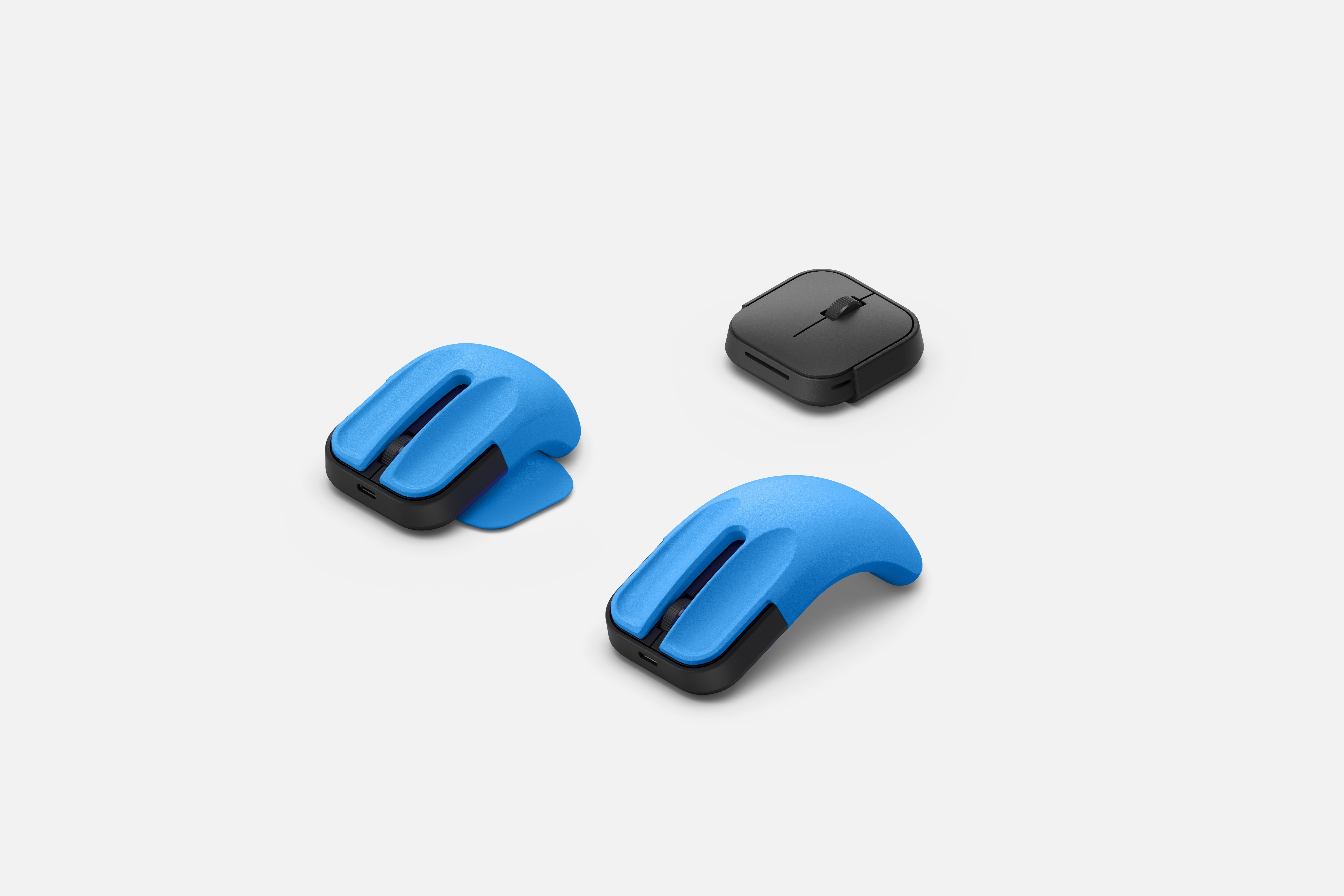 Microsoft adaptive mouse with two blue 3D printed mouse tails
