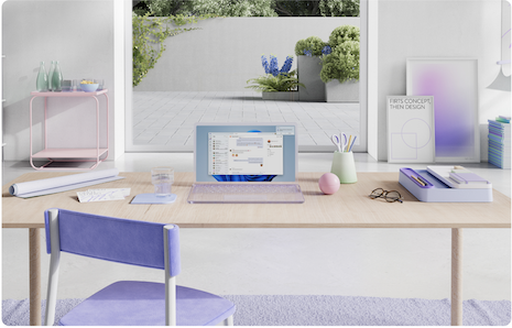 Desk with laptop, empty chair