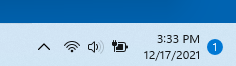 Shows the right side of the taskbar, with the time and date that are the Notification Center, and a badge that shows the number of notifications.