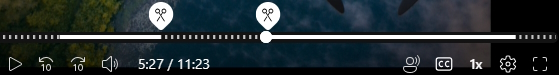 A video player timeline with scissor icons indicating the part of the video that will be cut. Parts that will be hidden are dashed lines on the video timeline.