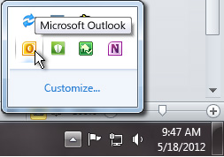 Notification area expanded to show the Outlook icon