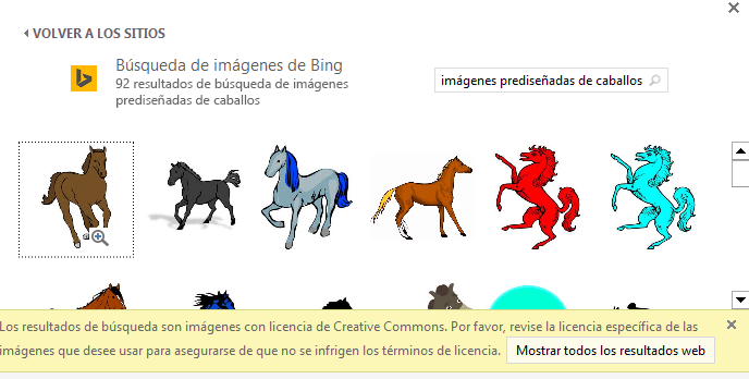 Si busca "imágenes prediseñadas de caballos" aparecen una variedad de imágenes bajo una licencia de Creative Commons.