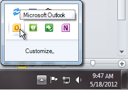 Notification area expanded to show the Outlook icon