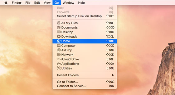 Macintosh Go izvēlnē ir iezīmēta opcija sākums.