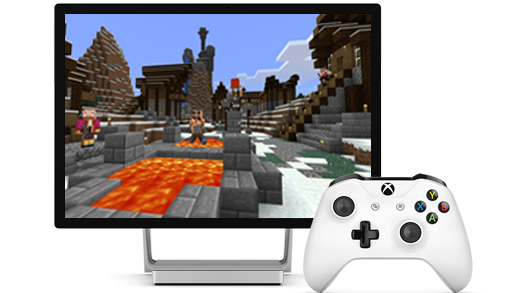 Изображен дисплей Surface Studio с игрой Minecraft на экране и геймпадом Xbox.